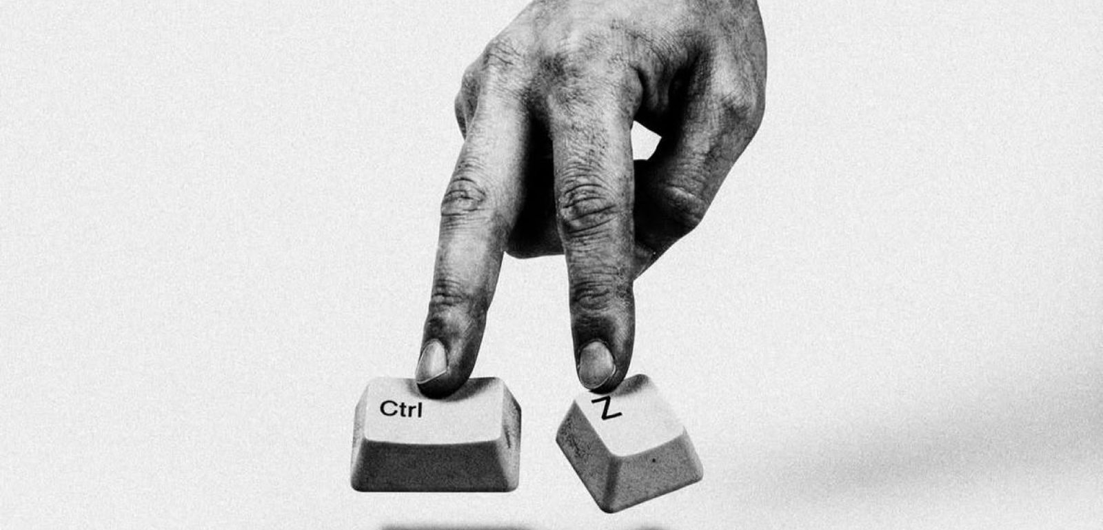 Hands pressing Ctrl and Z keys